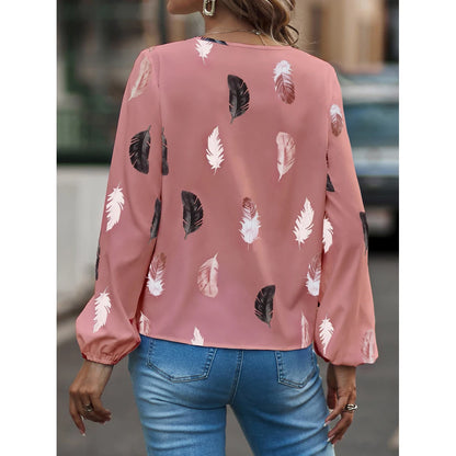 Nefeli | Elegante blouse met speelse verenprint