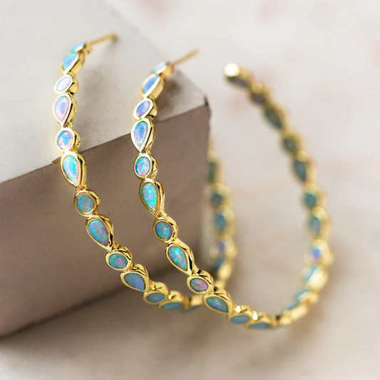 Gouden Cirkel Oorbellen met Vintage Blauwe Opale